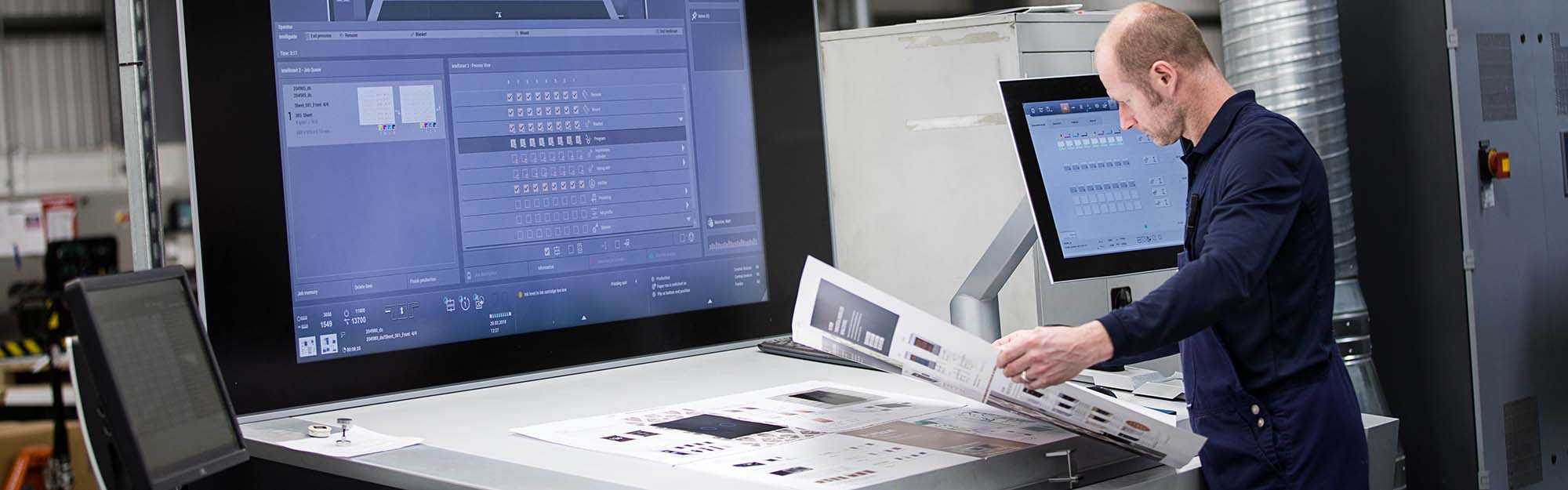 Employee inspecting printing